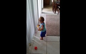 Toddler Struggles To Pick Up Balls - Kids - VIDEOTIME.COM