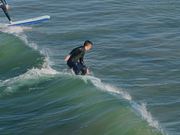 Man Surfing a Wave