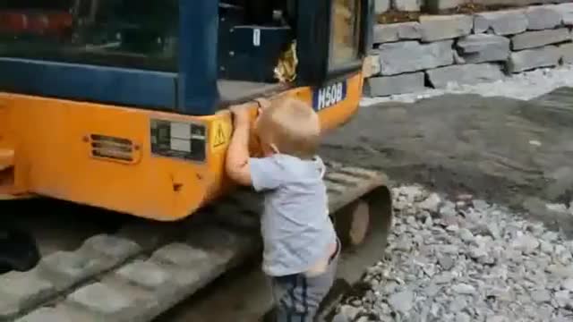 Three-Year-Old Operating A Real Excavator