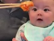 Toddler Reacting To Delicious Looking Food