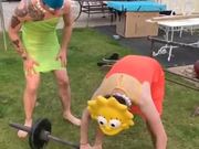 Two Men In Cosplay Lifting The Weight Bar