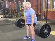 An Old Woman Lifts A 220 Lb Weight