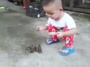 Tiny Kid Feeding The Tiny Birds
