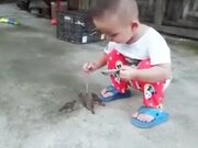 Tiny Kid Feeding The Tiny Birds