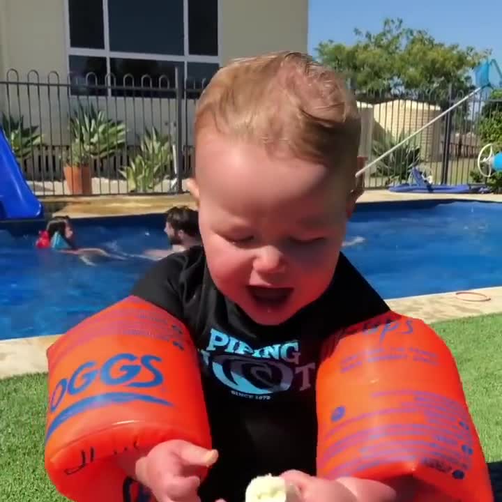 Baby Trying To Eat Banana While Wearing Floaties