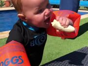 Baby Trying To Eat Banana While Wearing Floaties