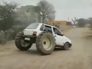 A Tiny Hatchback With Two Tractor Wheels?