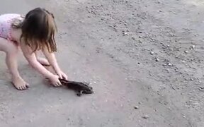 Little Girl Playing With A Frog - Animals - VIDEOTIME.COM