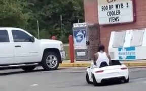 Man In A Children's Electric Car - Fun - VIDEOTIME.COM