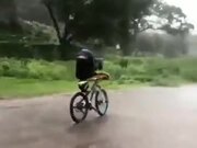 Australian Guy Riding A Bike In The Rain