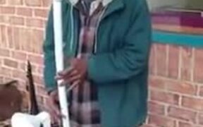 Man Playing Water Pipe Saxophone