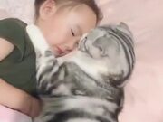 Cat Enjoying Sleeping With Little Girl