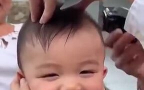 Giggling Baby Getting A Haircut