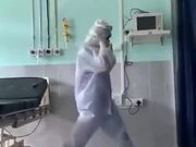 A Doctor Dancing In A PPE Kit