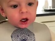 Kid Getting Frustrated To Blow Out A Candle