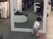 Baby Trying To Figure Out How A Mirror Work