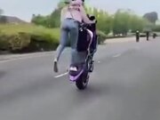 Biker Girl Performing Amazing Wheelie Stunt