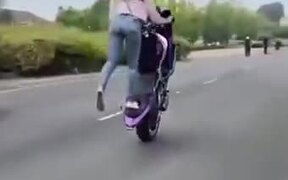 Biker Girl Performing Amazing Wheelie Stunt - Fun - VIDEOTIME.COM
