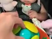 Baby Experiencing Vibrating Magic Ball