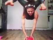 Girl Performing Gymnastics On A Ball