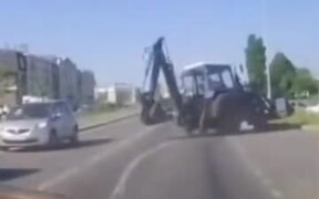 Excavator On Road Loses Rear Wheel