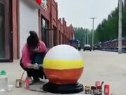 Cool Painting On A Sidewalk Stone Sphere