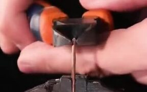 Slow Motion Zoomed Footage Of Wire Being Cut - Tech - VIDEOTIME.COM