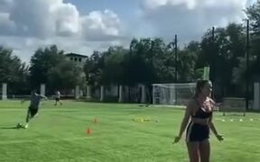 Football Shot Hitting A Bottle Over Woman's Head - Fun - VIDEOTIME.COM