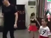 Man And Two Little Children Do The Shuffle