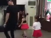Man And Two Little Children Do The Shuffle