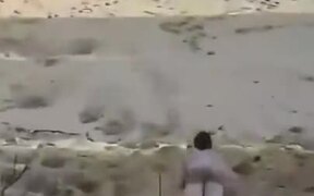 Man Dune Surfs His Way Into The Sea - Fun - VIDEOTIME.COM