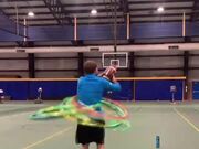 Man Throws Ball Into Basketball Hoop