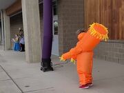 Kid Wears Inflatable Doll Costume And Dances