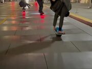 Guy Riding Skateboard While Performing Handstand