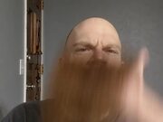Man Funnily Covers Face With His Long Beard