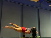 Woman Performs Handstand and Other Tricks