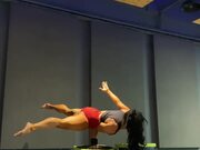 Woman Performs Handstand and Other Tricks