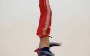 Guy Performs Multiple Headspins and Tricks