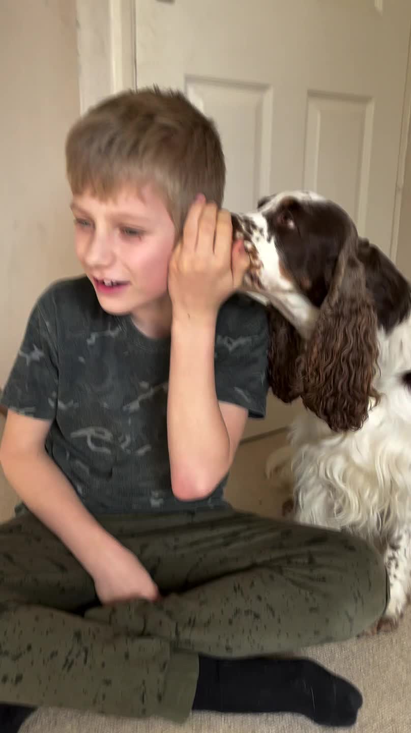 Dog Tries to Whisper into Owner's Ears