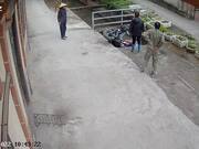 Man Transporting Heavy Load Falls Through Concrete