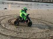 Electric Quad Spinning Donuts on the Beach