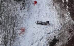 Hill Climber Trying to Stop Tumbling Snowmobile - Sports - VIDEOTIME.COM