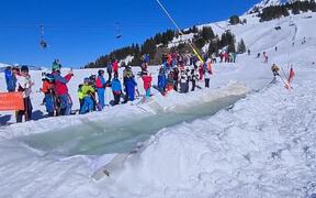 Downhill Skiers Glide on Water - Sports - VIDEOTIME.COM