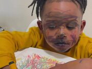 Child with Marker on His Face Plays Innocent