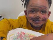 Child with Marker on His Face Plays Innocent