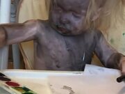 Child Covered in Paint