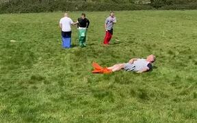 Adults Fumbling All Over While Playing Sack Race - Fun - VIDEOTIME.COM