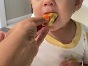 Toddler Pretends to Eat Bread and Enjoy it