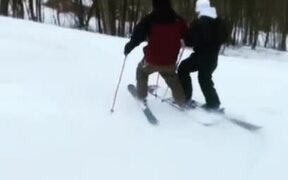 Duo Shares Ski While Skiing Downhill - Sports - VIDEOTIME.COM