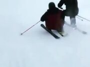 Duo Shares Ski While Skiing Downhill